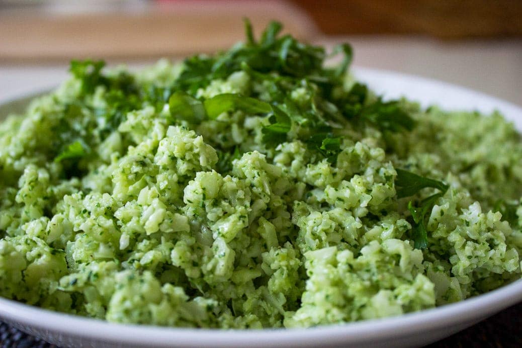 Cauliflower 'rice' with Pesto. Basil, spinach, lemon zest, Parmesan and garlic add some serious flavour to this healthy vegetable side dish.