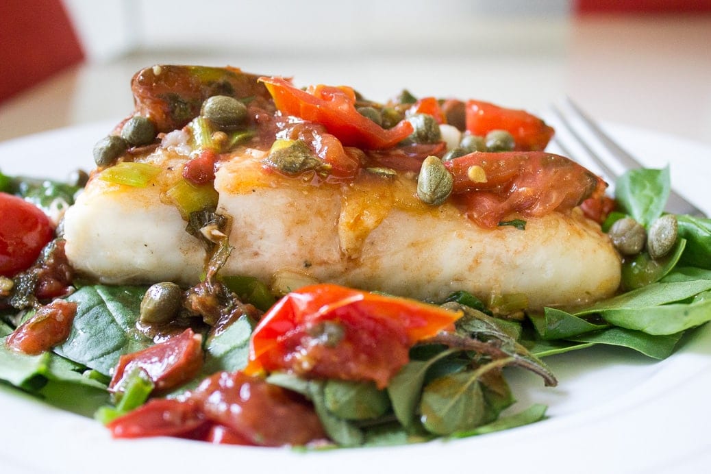 Roasted Halibut with Tomatoes and Capers. Silky fish topped with delicious flavours.